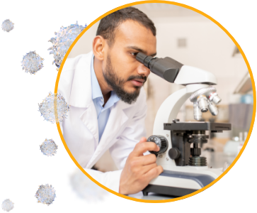 cancer researcher looking through a microscope