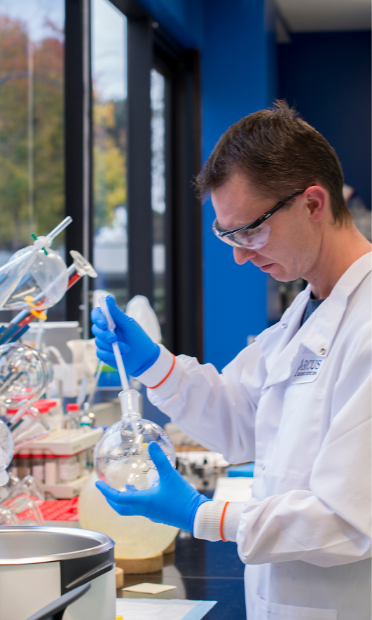 Scientist working with laboratory glassware